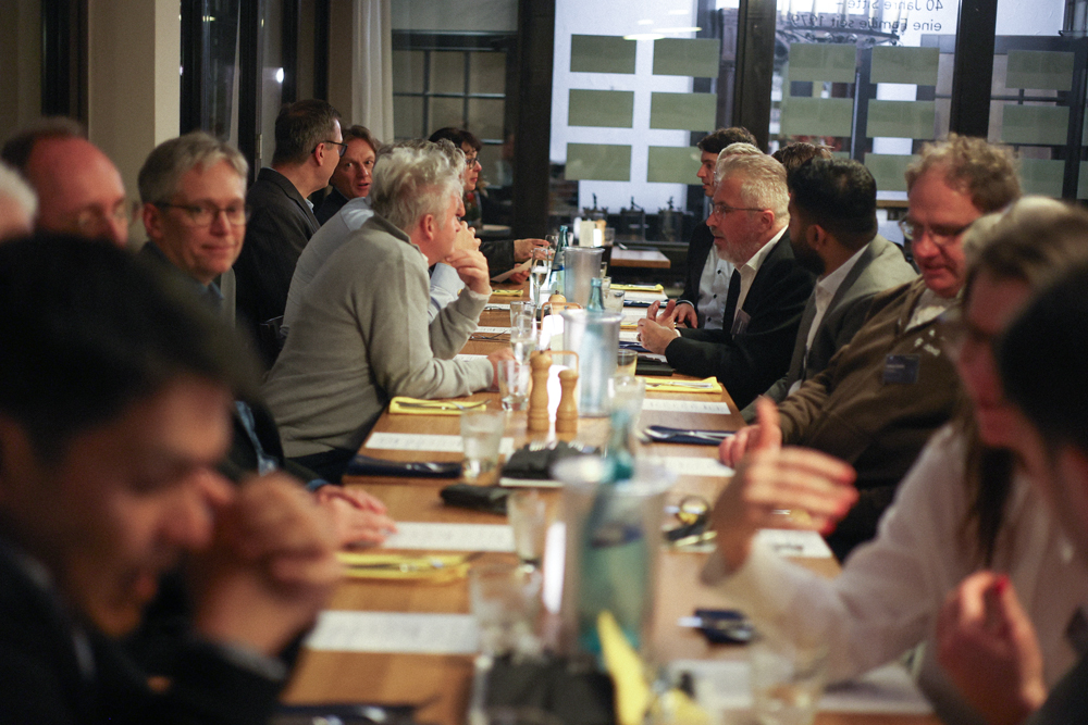 investors and entrepeneurs networking during dinner